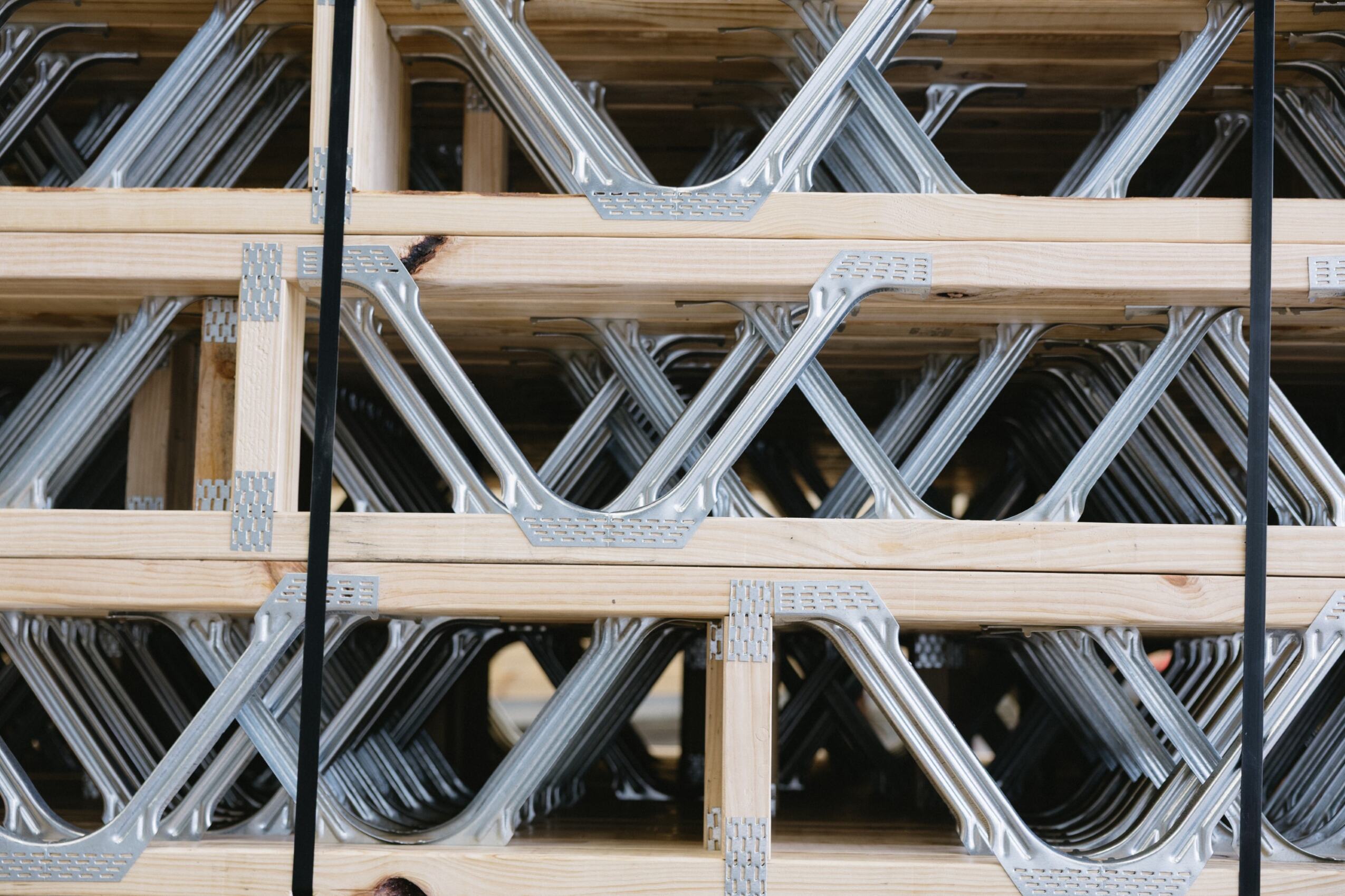 Close-up of floor posi truss steel webs and timber chords