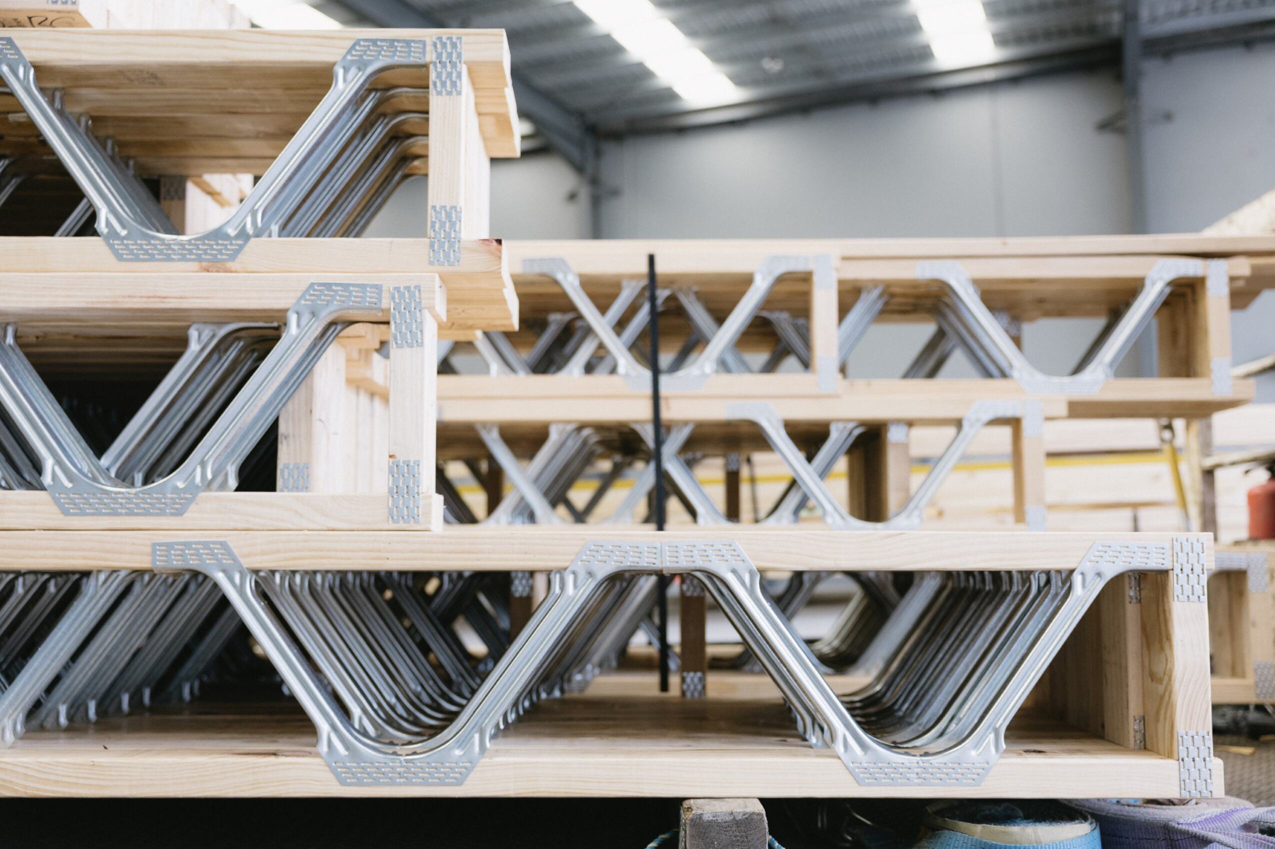 Stacked floor posi trusses ready for transport and installation